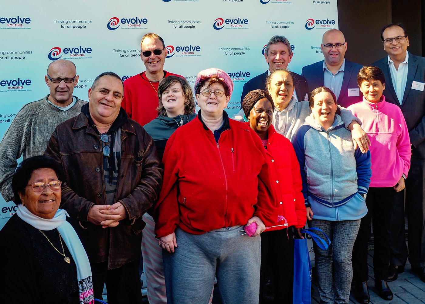 Some of the residents, Evolve Housing CEO Lyall Gorman (back row, third from right), City of Canterbury Bankstown Mayor Clr Khal Asfour (back row, second from right) and Evolve Housing General Manager Community Business and Growth Jitender Balani (back row, first from right)